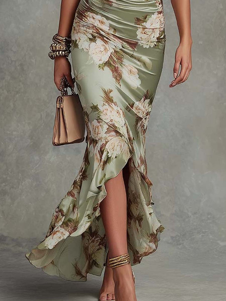 Anna - Long asymmetrical green satin dress with a V-neckline, puff sleeves and a floral print