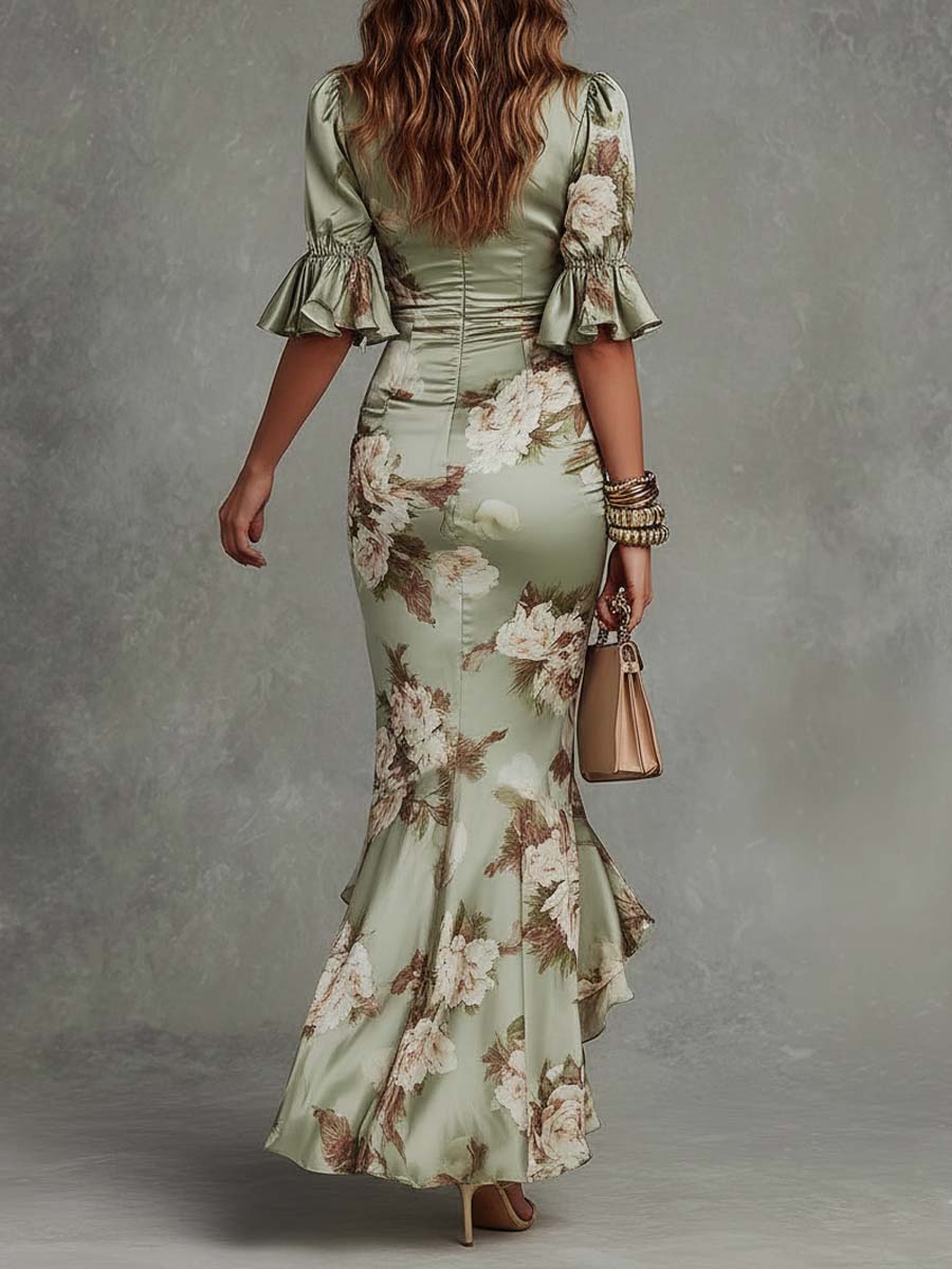 Anna - Long asymmetrical green satin dress with a V-neckline, puff sleeves and a floral print