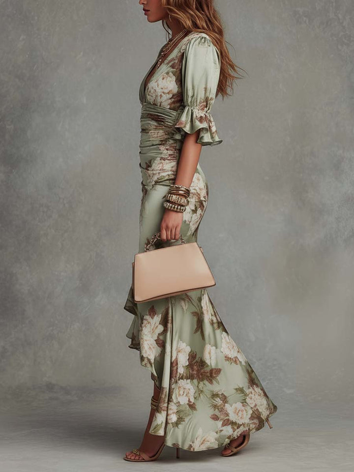 Anna - Long asymmetrical green satin dress with a V-neckline, puff sleeves and a floral print